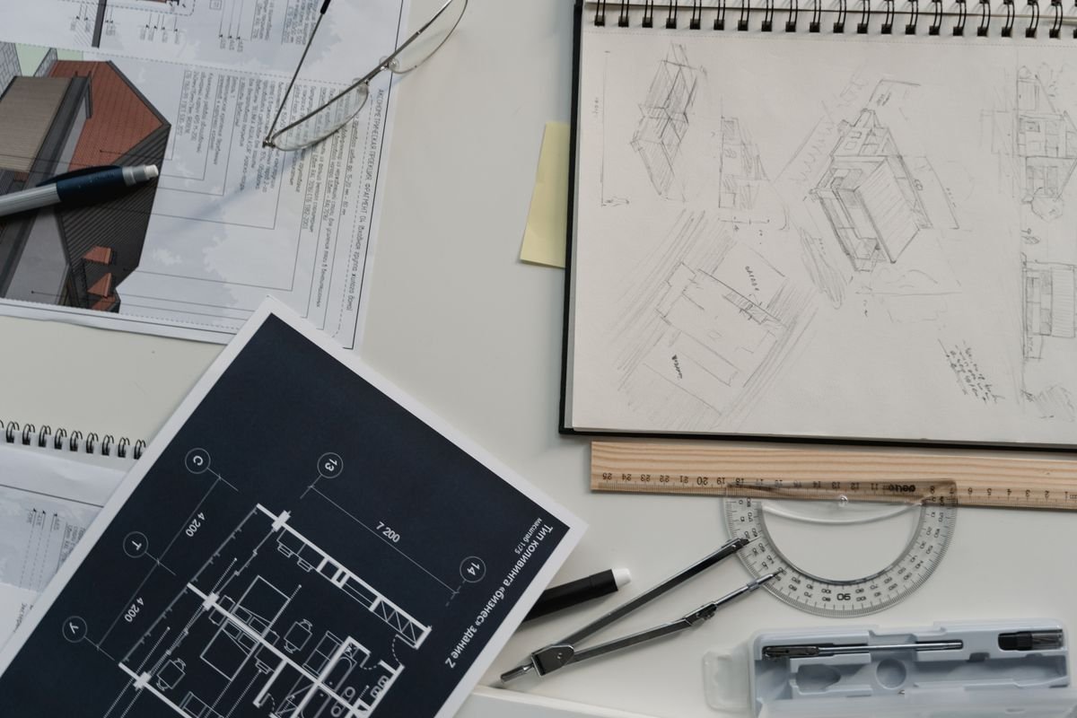Architectural drawings and planning tools on a desk